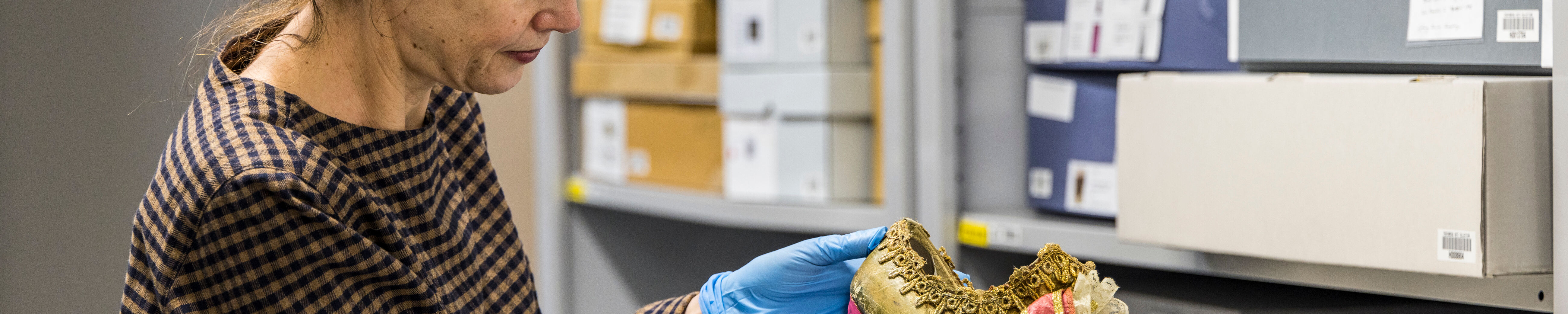 Curator Margot Anderson with shoes from Don Quixote. Photographer Mark_Gambino