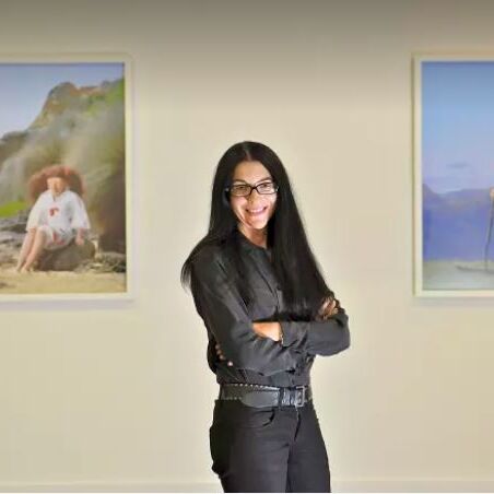 Via The Age. Polixeni Papapetrou pictured with her works at a 2012 show at Melbourne's Nellie Castan Gallery. Photo: Wayne Taylor