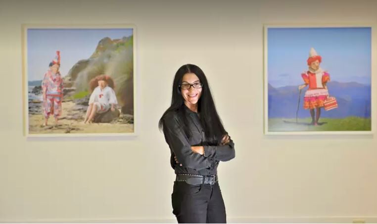 Via The Age. Polixeni Papapetrou pictured with her works at a 2012 show at Melbourne's Nellie Castan Gallery. Photo: Wayne Taylor